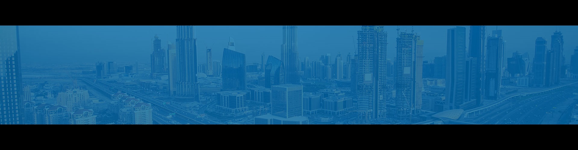 Dubai cityscape with blue overlay. 