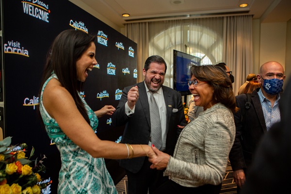 Paola Rojas embraces San Diego Tourism Authority President & CEO Julie Coker 