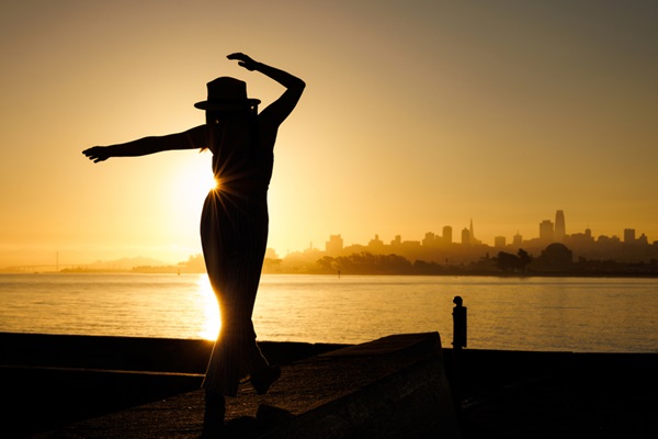 Silhouette of influencer looking across the Bay at San Francisco