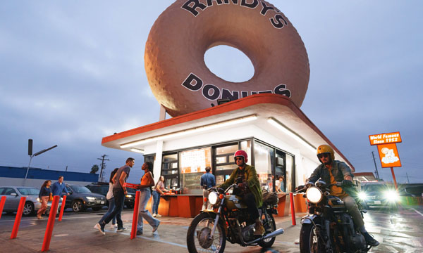 two motorcycles roll up to Randy's Donuts in Los Angeles in Visit California's Born To Be Wild TV spot